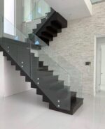 Interior Designs. Contemporary L-Shaped Staircase For Homes, modern L-shaped staircase, contemporary staircase design, L-shaped staircase design, modern staircase for homes, residential staircase design, luxury staircase design, custom L-shaped staircase, bespoke staircase for home, stylish staircase ideas, space-saving staircase, modern indoor staircase, elegant home staircase, staircase installation services, custom staircase installation, modern staircase railing, wooden L-shaped staircase, glass staircase design, metal staircase design, floating staircase design, staircase renovation, home interior staircase, luxury home interiors, modern house staircase, staircase contractors Kenya, staircase installation Kenya, staircase design Kenya, interior designers Kenya, Nairobi staircase design, Nairobi staircase installation, L-shaped staircase Nairobi, modern staircase Nairobi, custom staircase Nairobi, home interior design Nairobi, luxury interior design Nairobi, staircase contractors Nairobi, Westlands staircase design, Kilimani staircase design, Karen staircase design, Runda staircase design, Lavington staircase design, Kileleshwa staircase design, Muthaiga staircase design, Parklands staircase design, Kasarani staircase design, Roysambu staircase design, Kiambu staircase design, Thika staircase design, Machakos staircase design, Mombasa staircase design, Kenya staircase design, Kenya interior design, residential staircase Kenya, modern home interiors Kenya, bespoke staircase Kenya, custom interior solutions Kenya, Mercie Interiors Nairobi, Mercie Interiors Kenya.