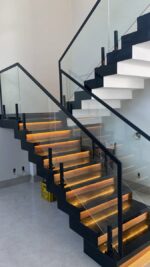 Interior Designs. Contemporary L-Shaped Staircase For Homes, modern L-shaped staircase, contemporary staircase design, L-shaped staircase design, modern staircase for homes, residential staircase design, luxury staircase design, custom L-shaped staircase, bespoke staircase for home, stylish staircase ideas, space-saving staircase, modern indoor staircase, elegant home staircase, staircase installation services, custom staircase installation, modern staircase railing, wooden L-shaped staircase, glass staircase design, metal staircase design, floating staircase design, staircase renovation, home interior staircase, luxury home interiors, modern house staircase, staircase contractors Kenya, staircase installation Kenya, staircase design Kenya, interior designers Kenya, Nairobi staircase design, Nairobi staircase installation, L-shaped staircase Nairobi, modern staircase Nairobi, custom staircase Nairobi, home interior design Nairobi, luxury interior design Nairobi, staircase contractors Nairobi, Westlands staircase design, Kilimani staircase design, Karen staircase design, Runda staircase design, Lavington staircase design, Kileleshwa staircase design, Muthaiga staircase design, Parklands staircase design, Kasarani staircase design, Roysambu staircase design, Kiambu staircase design, Thika staircase design, Machakos staircase design, Mombasa staircase design, Kenya staircase design, Kenya interior design, residential staircase Kenya, modern home interiors Kenya, bespoke staircase Kenya, custom interior solutions Kenya, Mercie Interiors Nairobi, Mercie Interiors Kenya.